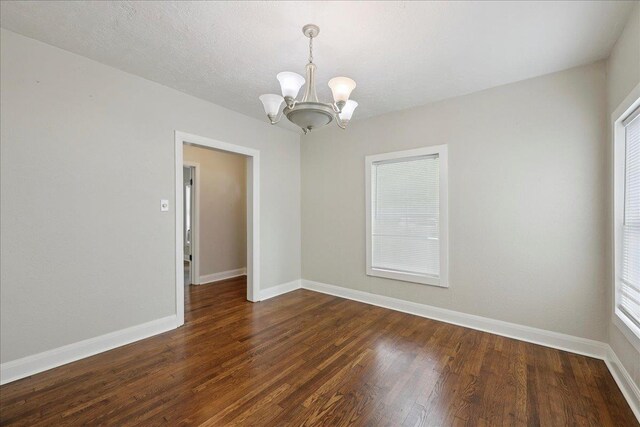 2218 Ashley St, Beaumont, TX 77701 - unfurnished room featuring a chandelier and wood finished floors
