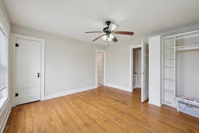 2218 Ashley St, Beaumont, TX 77701 - unfurnished bedroom featuring light wood-style flooring and a ceiling fan