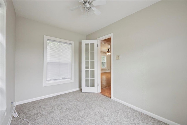 2218 Ashley St, Beaumont, TX 77701 - unfurnished room with a ceiling fan, carpet flooring, and french doors