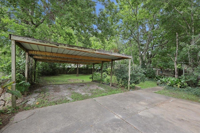 2218 Ashley St, Beaumont, TX 77701 - view of car parking featuring a detached carport and driveway