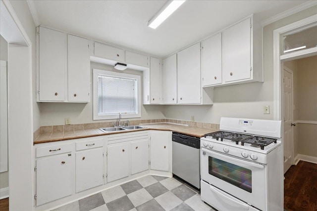 2218 Ashley St, Beaumont, TX 77701 - kitchen featuring white gas range, dishwasher, and white cabinetry