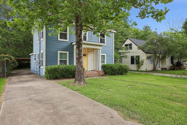 2218 Ashley St, Beaumont, TX 77701 - view of front of house with a front lawn and concrete driveway