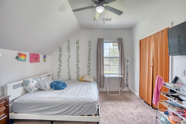 1062 Bassett St, Orange, TX 77632 - carpeted bedroom with vaulted ceiling and a ceiling fan