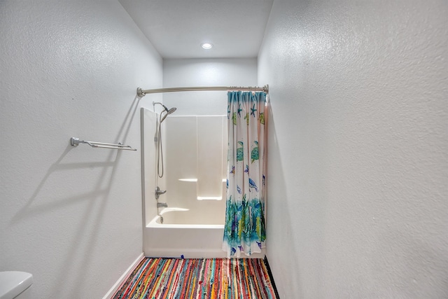 1062 Bassett St, Orange, TX 77632 - bathroom with shower / tub combo with curtain and toilet