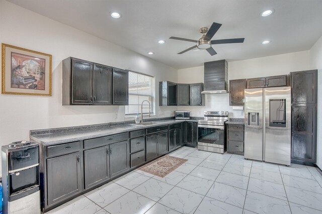 1062 Bassett St, Orange, TX 77632 - kitchen with appliances with stainless steel finishes, wall chimney exhaust hood, a ceiling fan, recessed lighting, and a sink