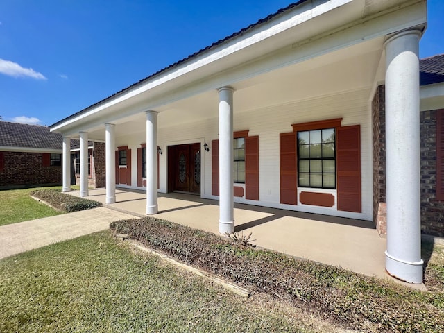 back of house featuring a porch