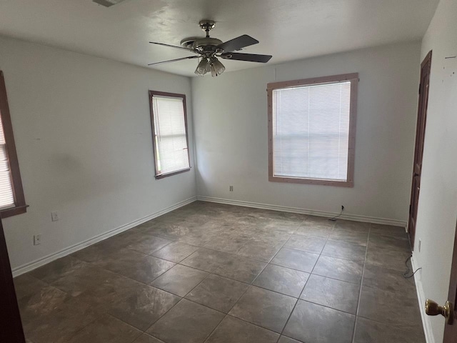 3808 Rachel Ave, Port Arthur, TX 77642 - tiled empty room featuring a ceiling fan and baseboards