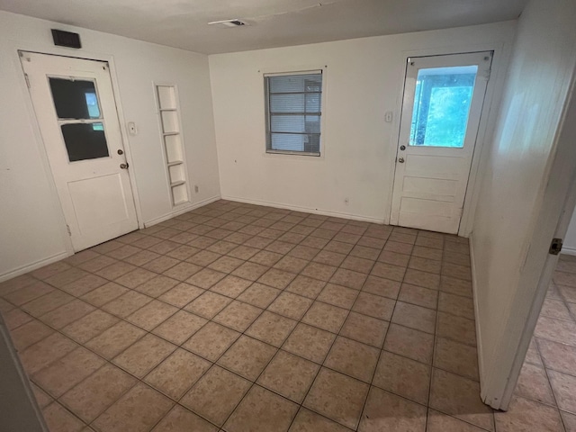 3808 Rachel Ave, Port Arthur, TX 77642 - foyer entrance featuring baseboards and light tile patterned flooring