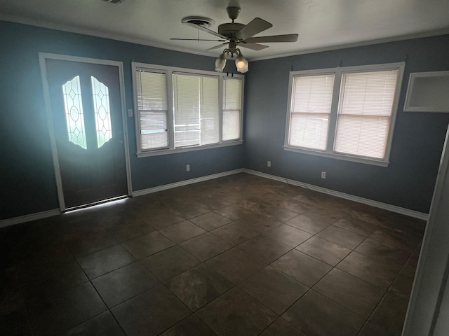 3808 Rachel Ave, Port Arthur, TX 77642 - entrance foyer with a ceiling fan, dark tile patterned flooring, and crown molding