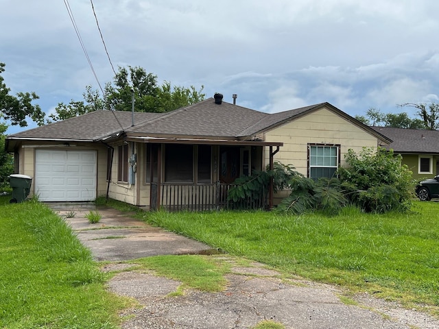 3808 Rachel Ave, Port Arthur, TX 77642 - view of front of property featuring driveway, an attached garage, a shingled roof, and a front lawn
