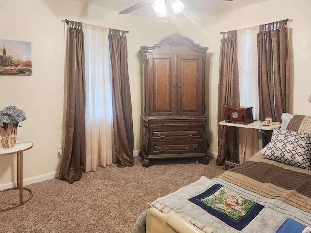 bedroom featuring light carpet and ceiling fan