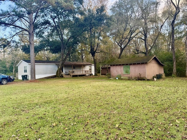 view of yard with a wooden deck