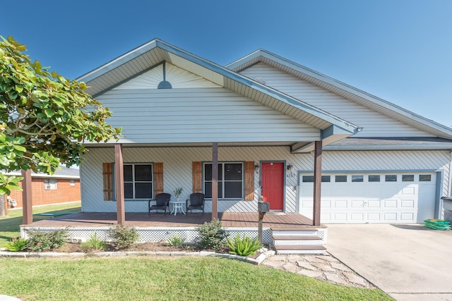 view of front of house featuring a porch, a garage, and a front lawn