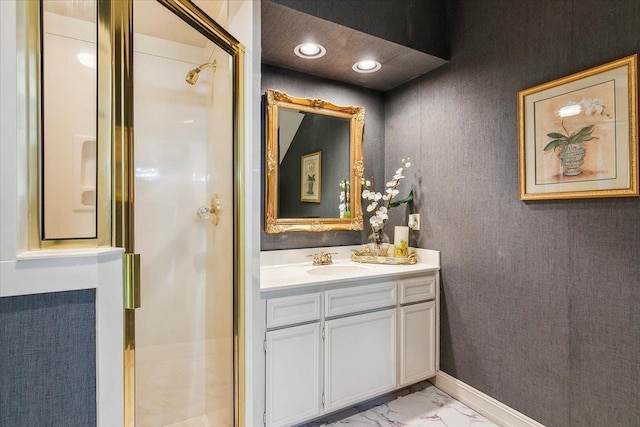 bathroom featuring vanity and an enclosed shower