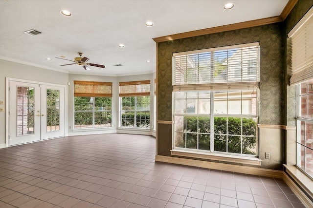 interior space featuring crown molding, tile patterned floors, french doors, and plenty of natural light