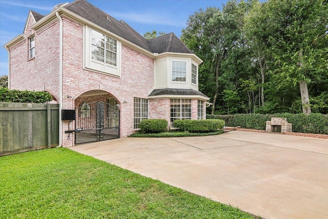 rear view of house with a lawn