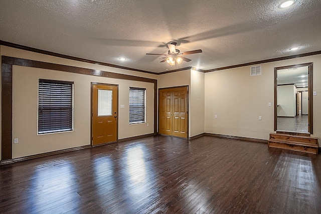 interior space featuring a textured ceiling, ceiling fan, crown molding, and dark hardwood / wood-style floors