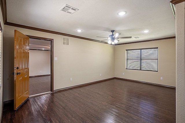 spare room with ornamental molding, ceiling fan, and dark wood-type flooring