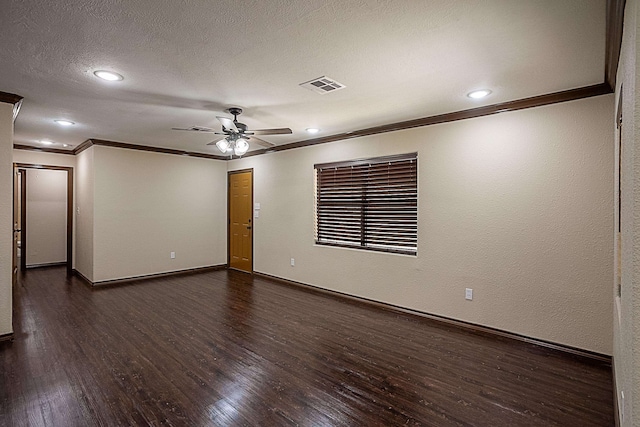 empty room with a textured ceiling, dark hardwood / wood-style floors, ceiling fan, and ornamental molding