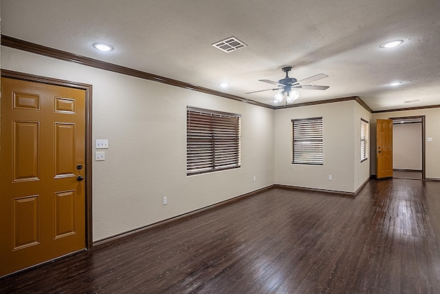 foyer with dark hardwood / wood-style flooring, a textured ceiling, ceiling fan, and ornamental molding