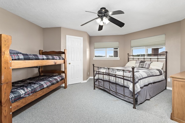 302 Waterwood Dr, Orange, TX 77630 - bedroom with baseboards, carpet, and a ceiling fan