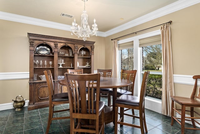 302 Waterwood Dr, Orange, TX 77630 - dining room with crown molding, a chandelier, and dark tile patterned floors