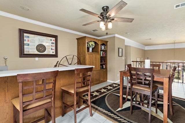 302 Waterwood Dr, Orange, TX 77630 - dining room featuring light tile patterned floors, a ceiling fan, crown molding, and baseboards