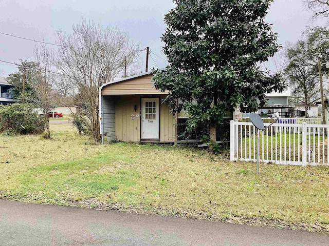 view of outbuilding with an outdoor structure and fence