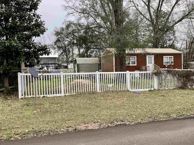 view of front of property with a fenced front yard and a front yard