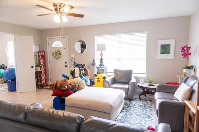 living room featuring ceiling fan, a healthy amount of sunlight, and light tile patterned floors