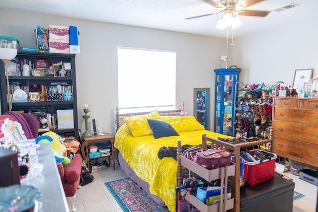 tiled bedroom with ceiling fan