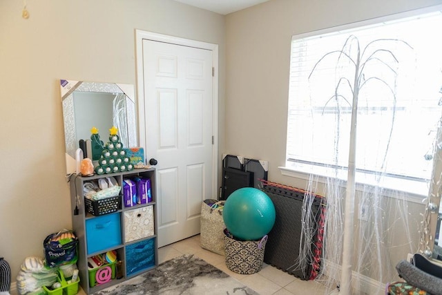 playroom featuring light tile patterned floors