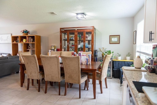 dining area featuring a textured ceiling