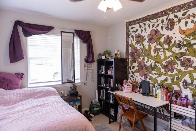 bedroom with ceiling fan and light tile patterned flooring