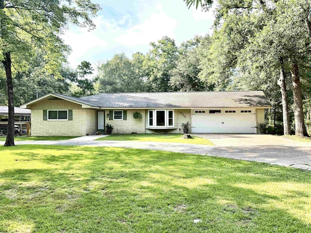 330 Hillcrest Dr, Lumberton, TX 77659 - single story home featuring driveway, an attached garage, a front lawn, and brick siding
