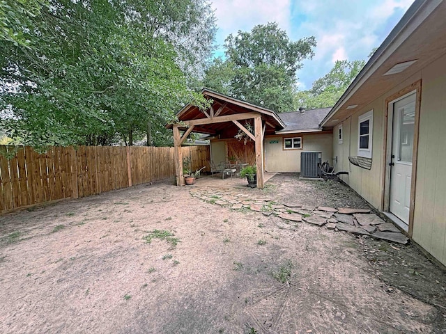 330 Hillcrest Dr, Lumberton, TX 77659 - fenced backyard featuring central AC unit and a patio