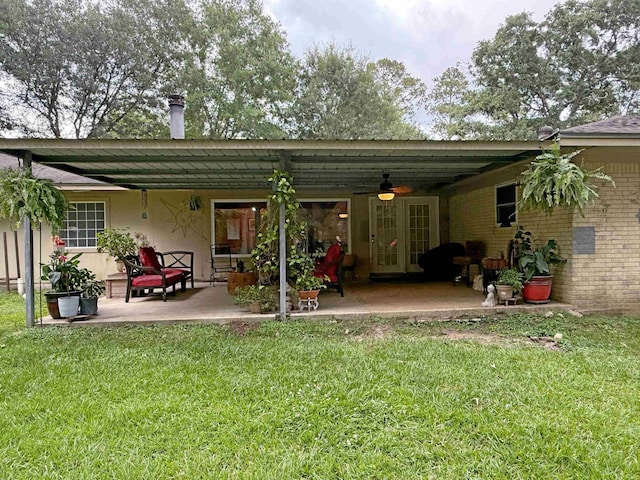 330 Hillcrest Dr, Lumberton, TX 77659 - back of property with ceiling fan, a patio, a lawn, and brick siding
