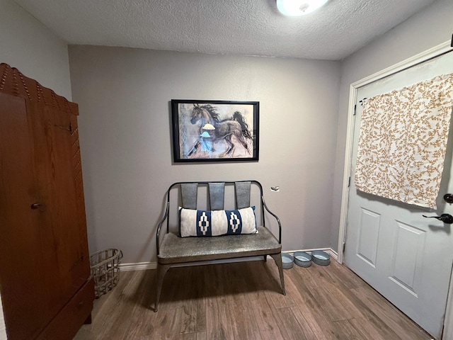 330 Hillcrest Dr, Lumberton, TX 77659 - sitting room with wood finished floors, baseboards, and a textured ceiling