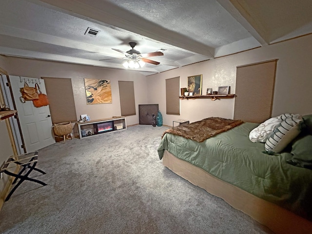 330 Hillcrest Dr, Lumberton, TX 77659 - bedroom with carpet floors, beamed ceiling, a textured ceiling, and ceiling fan