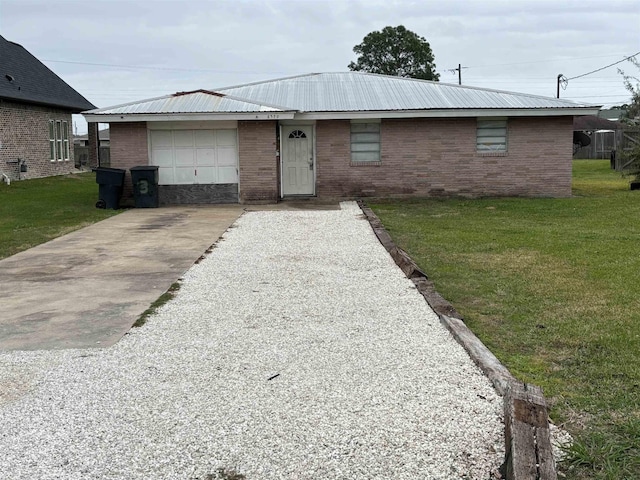 ranch-style home with a garage and a front lawn