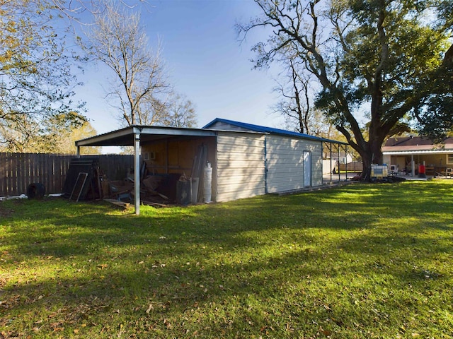 view of outbuilding with a lawn