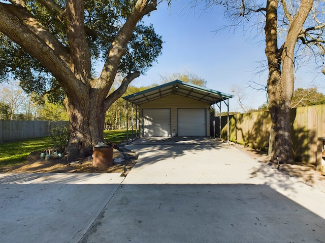 view of front of property with a garage and an outdoor structure