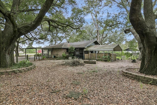 back of property featuring a carport