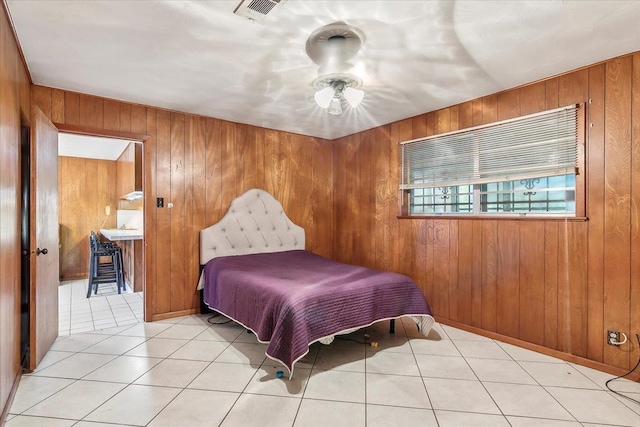 tiled bedroom with wood walls