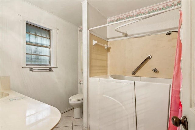 bathroom with tile patterned flooring, toilet, and shower / bathtub combination