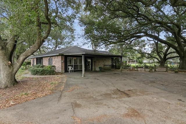 exterior space with a carport