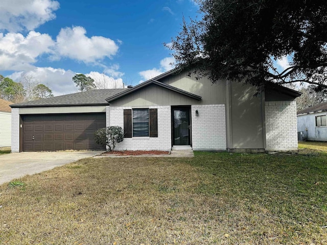 ranch-style home with a garage and a front yard