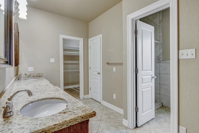 bathroom with tile patterned flooring and vanity