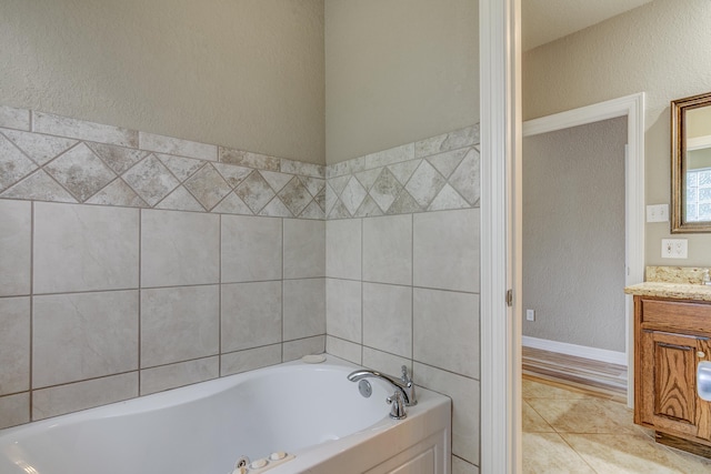 bathroom featuring a tub and vanity