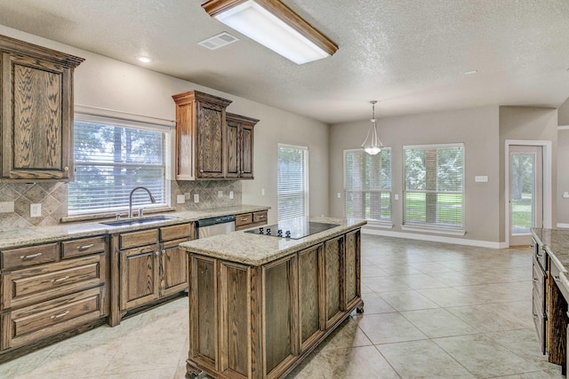 kitchen featuring black electric stovetop, a kitchen island, sink, and tasteful backsplash